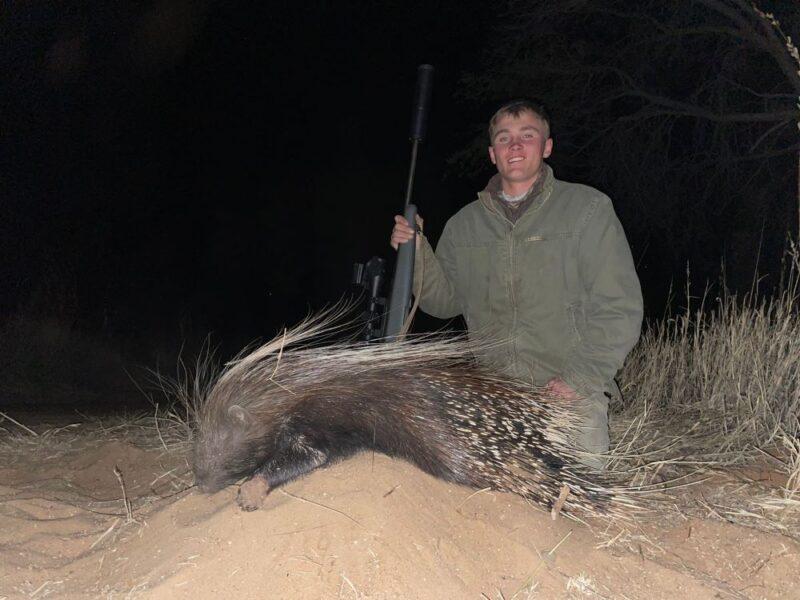 A man with his prized porcupine trophy
