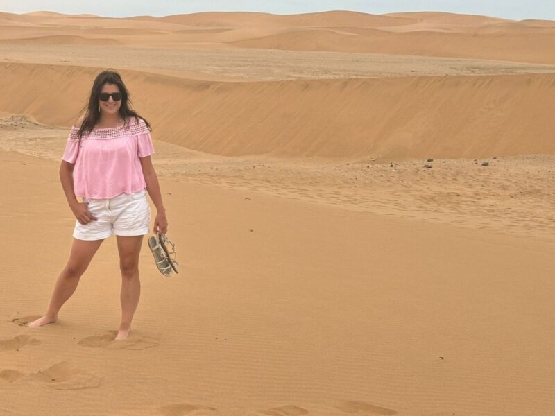 Lady standing barefoot in the Namib Desert