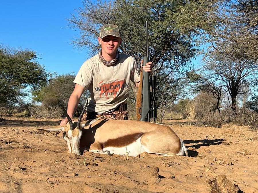 Logan with his trophy, after a successful game hunting adventure.